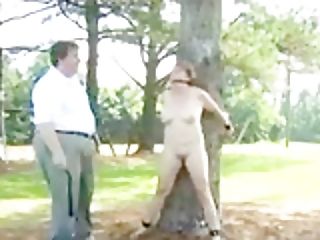 Woman Tied To Tree For Light Restraint Bondage